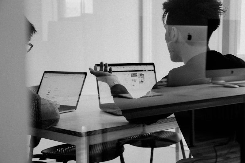 Reviewing marketing work together at a desk